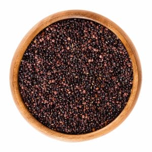 black quinoa seeds wooden bowl