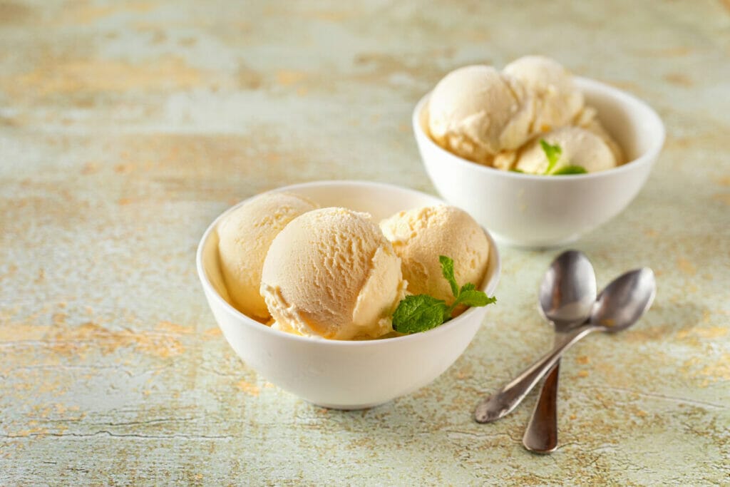 organic vanilla ice cream white dessert plates pastel background